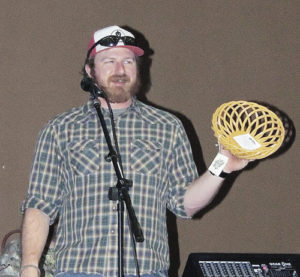 John Whipple, the outdoor leadership coordinator and challenge course manager at Colorado Northwestern Community College, filled the roles of cook, emcee and auctioneer Saturday night at the sixth annual Wild Game Dinner fundraiser for the Spartan Times and Spartan Rock & Ice. Dinner entrées featured bison, elk, deer and salmon cooked a variety of ways. Winners in the cooking contest were Alden Vanden Brink and his elk porcupine meatballs, which tied with for first place with Sue Forward’s buffalo roast soup, followed by Whipple’s buffalo pepper steaks.