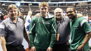 Rangely head wrestling coach Jeff Heinle and assistant coaches Gary Bennett and Blane Warrier stand next to senior Ethan Allred, the only Panther to qualify for the 2015 Colorado State Wrestling Championships. Allred won a match in the 2A, 170-pound bracket before being eliminated.