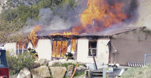 At about 3 p.m. on April 22, a home at 1107 Pinyon St. in Meeker, above, was reported on fire. The fire quickly consumed the home of Glen and Rose Abbott, but no one was home and no one was hurt. Meeker Fire and Rescue was able to save the garage, just a few feet southwest of the home. 