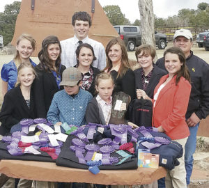Members of the Rio Blanco County 4-H Livestock Judging Team are pictured here with all of their awards following the Four Corners Ag Expo at the exhibition grounds in Cortez on March 16. Pictured in back row is Ty Dunham; middle row, from left to right, are: Jilly Bumguardner, Kacie Lapp, Madi Shults, Macy Collins and Marryn Shults; front row, from left to right, are: rookies Tatumn Kennedy, Hayden Shults and Eva Scritchfield. Not pictured are Abbi and Will Schwartz.