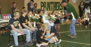 Rangely Youth Wrestling Program head coach Jeff LeBleu hands a commemorative plaque to Anne Turner, widow of Bill Turner, during Saturday’s youth wrestling tournament in Rangely. Bill Turner, a 1958 Rangely High School state wrestling champion and longtime Meeker wrestling coach and Colorado High School Coaches Association Hall of Fame coach, passed away Feb. 22.