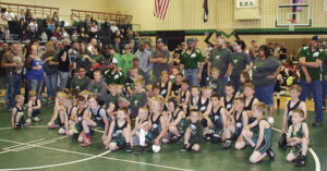 Rangely youth wrestlers take a “champion’s stance” during Saturday’s dedication of the Rangely Youth Wrestling Tournament as the Bill Turner and Family Legacy Day.