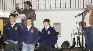 The highlight of the After Birth Ball was the auctioning of local FFA members with the high bidders getting a team of workers. Above is the Worker Lot No. 7, titled You Can’t Roller Skate in a Buffalo Herd. Bryce Purkey, far right, was the auctioneer and the team of Chase Rule, Hunter Garcia, Sheridan Harvey and Casey Turner (not pictured) drew the highest bid of $660 from Shelton Ranch. 