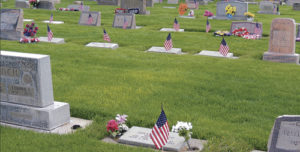 Throughout much of Highland Cemetery in Meeker on Monday, the number of Meeker residents who had served in the military is denoted by a small American flag placed on the graves of veterans. A strong percentage of those buried in Highland Cemetery have served in the Armed Forces, and many friends and family members were on hand at 10 a.m. at the cemetery to honor and recall those who gave up their lives in service to this country.