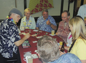 From top left, Carol and Rich Parr of Meeker were two of those who were playing blackjack Saturday night at the annual Pioneers Healthcare Foundation Gala at the Fairfield Center in downtown Meeker. The two players at the bottom of the photo are Stan and Patty Wyatt, while the couple at the far right is unidentified and the dealer at the far left and all the other dealers were brought in from Denver. Blackjack, Texas hold’em and craps were available.