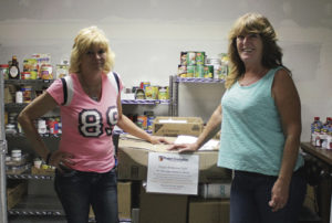 On May 20, Leana Cox, right, of Colorado Northwestern Community College’s Rangely Campus, the advisor for the campus Phi Theta Kappa chapter, organized a food drive. The efforts were “not too shabby,” Cox said. Chris Brasfield, left, who runs the Rangely Food Bank, was delighted. She said the food bank is in dire need of canned goods and that if PTK had not collected the food, she had no idea what the bank would have had available to hand out in the past week. Cox said she was glad for the effort and very proud of the way the students chipped in. PTK is the national honor society for two-year colleges in the United States.