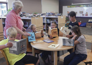 Meeker Elementary School Library received a book donation from the Will James Society. The library was gifted 10 books written by Will James that will be used in the library, available next school year. Some fourth-graders came to look at the books and were very excited to preview them, saying they can’t wait to check them out. Above, the kids check out the new books under the watchful eye of school librarian Kay Bivens.