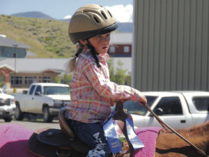 Proud of her first-place ribbons is Isabella Brown of Vernal, Utah, who was busy Friday morning competing in the PeeWee Horsemanship Class events. Several children from Utah and Northwest Colorado, including Rangely and Meeker, competed in the class events.