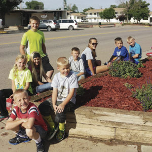 Ten members of the Rangely 4-H Club volunteered to complete one of the town’s latest beautification projects the morning of July 8. The members planted more than 60 perennials in seven flowerbeds on both sides of Main Street between  True Value’s garden center, Main Street Café and Raven Realty. Those members pictured, from front to back, are: Hudson Torsell, Easton Torsell, Ryan Mergelman, Kastyn Dembowski, Philip Noyes, Justin Allred, Klaire Denny, Josh Dunn and Jaxon Torsell.