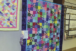 Numerous quilts of all sizes, shapes and designs were on display in the exhibit hall at the Rio Blanco County Fair, demonstrating the talents of the quilters throughout Rio Blanco County. The center quilt was chosen for second place and Reserve Champion honors. The quilt was completed by Lori Farris.