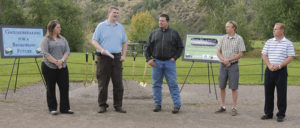 A groundbreaking ceremony was held Wednesday in Meeker Town Park to mark the start of the Rio Blanco County-wide construction on a broadband Internet system for all parts of the county. Speaking to roughly 40 people present were, from left, county Economic Development Director Katelin Cook; county IT Coordinator Blake Mobley; County Commissioner Jeff Eskelson; Alex Thorquist of network operator colorado.fiber.community; and Meeker Town Administrator Scott Meszaros. All spoke of the importance of this project to Rio Blanco County and what it will mean for economic development and everyday life in the county.
