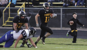 Hunter Garcia gets a block from T.J. Shelton as he returns a punt down the sideline. Garcia put his team in great field position with his punt return skills and finished the game with 134 all-purpose yards. 