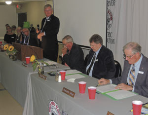 A full house of company officials and members of White River Electric Association filled the Fairfield Center for the WREA’s annual Meeting of the Membership on Sept. 9. After being fed by the Meeker Lions Club, the company officials and members got down to business, first listening to WREA General Manager Alan Michalewicz (standing). Also at the head table are, from left to right, WREA Counsel Trina Zagar-Brown, and WREA board members Gary H. Dunham, Richard L. Parr, Hal W. Pearce, Michalewicz, Board President William H. Jordan and board members Stan Wyatt and Ronald K. Hilkey. Present but not in the photo is Richard R. Welle.