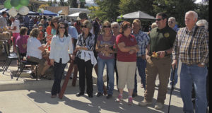 Folks at the annual Mountain Valley Bank’s annual Fall Festival on Saturday wait anxiously for the annual cake/pie/salsa auction and the Ute Indian dancers from Fort Duchesne, Utah.