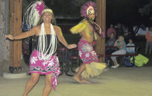 Flora Bella florists in Meeker threw a thank-you exhibition for its customers on Friday night at Meeker Town Park, and well in excess of 100 people watched and joined in the entertainment provided by the Polynesian Fire Dancers. The duo offered dances from the South Pacific islands of Hawaii, Samoa and New Zealand, getting several women and girls in the audience to learn the hula and a couple of local men to learn a Maori chant from New Zealand.