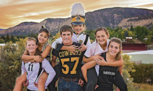 Meeker High School Homecoming activity representatives pile on for a big “Go-Cowboys” Week, which begins Monday. From left to right are: Maggie Phelan in volleyball; Delenn Mobley for cheerleading; Chase Rule for football; Madeline Amack for the marching band; Sierra Williams in softball; and Julia Eskelson for cross-country.