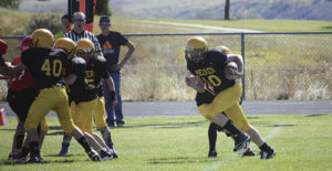 Barone Middle School seventh-grade quarterback Ryan Phelan gets some good blocking from his linemen against the Steamboat Springs Sailors. The young Cowboys have lost twice to the Sailors this season, but they beat Grand Valley. The eighth-grade team is still looking for its first win of the season. More than 37 kids went out for the team, which is coached by Darby Finley, Clinton Kilduff, Chip Brown and Jason Browning. The Cowboys will play in Craig on Saturday, then host Glenwood Springs the following week in the final game of the season.