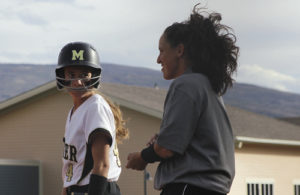 Meeker High School softball coach Briana Williams smiles after Gracie Bradfield got a base hit during a game against Basalt. Meeker’s record is 9-6 overall, 4-2 in league and currently on a three-game winning streak after pounding Aspen twice in a doubleheader and Basalt, all at Paintbrush Park. Meeker will play in Rifle today and Gunnison on Saturday before the regional tournament starts the following week.