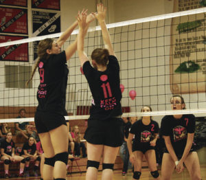 Meeker volleyball players Reese Pertile and Maggie Phelan go up for a block against the Eagles in Paonia. The lady Cowboys lost in three games to the Eagles and then to Cedaredge last Saturday. Meeker will get another shot at Cedaredge, as the Bruins come to town Friday.