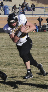 Meeker’s sophomore quarterback Logan Hughes is pictured following lineman Tyler Ilgen’s block into the end zone. Hughes scored a rushing touchdown and two, two-point conversions and Ilgen, along with his teammates, blocked for more than 400 yards against the Platte Canyon Huskies. Meeker won the game and will host the Resurrection Christian Cougars in Starbuck Stadium on Saturday, starting at 1 p.m.