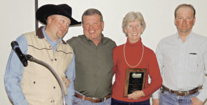 Neil Brennan, left, president of the White River Conservation District Board of Supervisors presented the Conservationists of the Year Award to Rocky Pappas, Sparky Pappas and Travis Flaherty at Friday’s annual meeting and banquet at the Fairfield Center in downtown Meeker. District manager Chris Colflesh reported there were 104 people present at the banquet.
