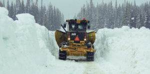 The Rio Blanco County Road and Bridge Department has quite a task each winter keeping county roads open for traffic or, in the case above, opening certain roads in the spring. Above, a county snow plow has more than 10 feet on each side of it as it plows its way to an open Ripple Creek Pass, located at the top of County Road 8, east of Meeker by about 50 miles.