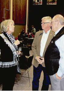 Joyce Rankin, left, a member of the Colorado Board of Education, and Bob Rankin, center, a member of the Colorado House of Representatives, speak with former legislator Russell George, now president of Colorado Northwestern Community College, at the Rangely Chamber of Commerce's annual Crab Crack and award dinner on Saturday.
