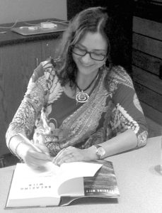 Author Diane Les Becquets signs a copy of her new novel, “Breaking Wild,” at a book signing held on Saturday at the Meeker Public Library.  Les Becquets spent several years as a child in the Meeker/Rio Blanco County area, and it was because of this background, as well as her general outdoor lifestyle in northwest Colorado—she hiked, camped, snowshoed, and hunted—that Les Becquets made this area the setting of the novel’s story. “After my many experiences in northwest Colorado, I knew I wanted the story to be set there,” she said.