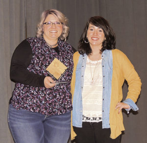As part of the festivities, top chamber awards were presented. At right, Rangely Chamber of Commerce Executive Director Kristin Steele, right, presented the Business of the Year award to Lindsay Wiley, owner of The Salon.