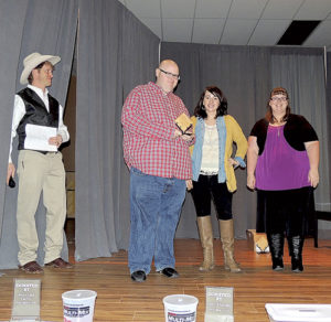 From left to right are: Crab Crack Master of Ceremonies Jed Moore, Pastor Shannon Brumfield, Chamber Executive Director Kristin Steele and Krystal Brumfield.