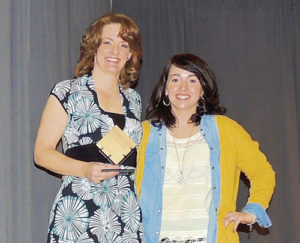 Naomi Legere, left, with the Non-Profit Business of the Year Award for the Rangely Museum, presented by Kristin Steele.