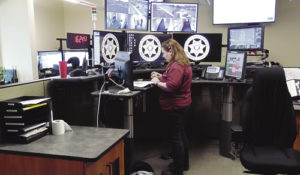 One of seven Rio Blanco County dispatchers, Rhawnie McGruder is seen here running the central desk, computers and display screens where 911 calls are first answered at the new Rio Blanco County Justice Center.