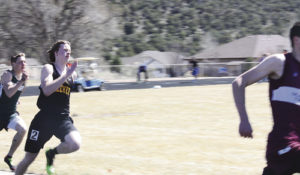 Meeker's Cole Brown can be seen here competing in the 200-meter dash last Saturday at Cedaredge. Brown finished 7th in the event. Brown and the Cowboy track teams will be competing at the Frank Woodburn Invitational Track Meet this Saturday in Grand Junction.