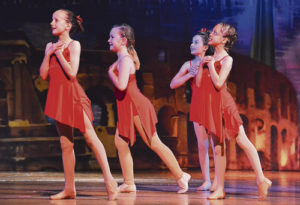 Third- and fourth-grade jazz dancers perform to “That’s Amore.” From left to right: Rhiwan Williams, Eva Scritchfield, Natalie Knight and Alli Sanders.