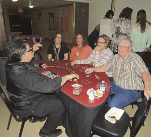 After the Forks & Flavors dinner held as part of the Pioneers Healthcare Foundation fundraiser event was casino night, when those in attendance could either stay in the main room at the Fairfield Center and dance or go out to the lobby and partake in some fun casino games. One such game was blackjack or “21” as seen above.