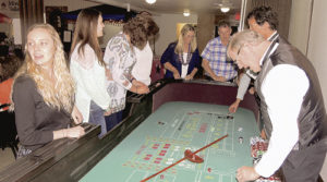 Professional dealers from Grand Junction kept the for-fun gamblers in line Saturday evening during the casino night portion of the Forks & Flavors Pioneers Healthcare Foundation annual fundraiser event. The dinner and fun were held at the Fairfield Center in downtown Meeker, and entertainment was provided by the Matt Holliday Band and casino night, which included the opportunity for one to brush up on the rules of craps, seen above.
