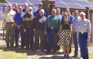 The White River Electric Association board of directors, management and staff joined representatives from the Meeker School District for the ribbon cutting ceremony of the Meeker Solar Garden on June 15. A cooperative effort between WREA and the Meeker School District allowed for the solar garden to be built at 450 School St., and the solar garden began generating solar power on June 1. WREA members who signed up for the solar lease program will begin receiving their monthly solar lease credits on their electric bills at the end of June. On hand for the ribbon cutting were, from left to right: Dale Dunbar (WREA CFO), Chris Reidinger (WREA Staff Engineer), Bill Jordan (WREA Board President), Alan Michalewicz (WREA General Manager), Gary Dunham (WREA Board of Directors), Hal Pearce (WREA Board of Directors), Richard Welle (WREA Board of Directors), Rich Parr (WREA Board of Directors), Stan Wyatt (WREA Board of Directors), Trina Zagar-Brown (WREA General Counsel), Chris Selle (Meeker RE-1 Superintendent), Todd Shults (Meeker RE-1 Board of Directors) and Ron Hilkey (WREA Board of Directors). 