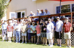 Meeker Men’s Club President Larin Crase, surrounded by most of his teammates, raises the “Cup” over his head in victory, after they defeated Rangely golfers 34-22 in the 12th annual Rio Blanco County Cup. The “Cup” will now be displayed in Meeker’s clubhouse for the next year.