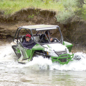 All kinds of Rio Blanco County terrain was encountered by the 160 drivers in the 2016 Wagon Wheel OHV Rendezvous held July 14-16. There was rock terrain, the  flats, the good trails and  the bumpy trails. However, in this case, Meeker riders Jeremy Ahrens and Kaylee Ridings found the wet terrain as they took their OHV ride through Miller Creek, located up County Road 8 east of Meeker. There were all kinds, sizes and colors of OHVs taking part in the rendezvous and riders were from mostly Colorado and surrounding states. A number of events, including a concert, dinners and a poker run were held to give the OHV riders something else to do between runs.