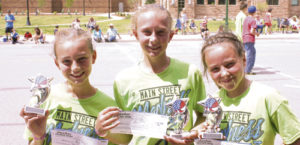 The four members of the Fireworks, a sixth- through eighth-grade girls team competing in the Main Street Madness three-on-three basketball tournament sponsored by the ERBM Recreation and Park District on July 4, won the age competition for the tournament. From left to right are: Jayden Overton, Emma Luce and Brealyn Garcia, all from Meeker. One team that disappeared before their photo was taken was the winning ninth- through 12th-grade team, the Shooting Stars, made up of Julia Dinwiddie and Makenna Burke from Meeker and two girls from Idaho.