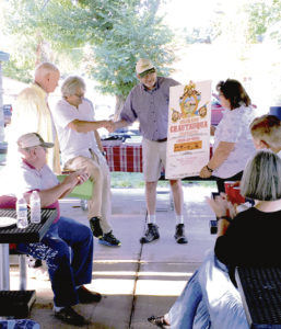 From left: On Aug. 13, Bob Sheets, the first director of the Colorado Council for the Arts, and sound artist Bruce Odland presented Rangely Town Manager Peter Brixius and Town Council member Lisa Hatch with a signed Chautauqua Tour poster to commemorate Odland’s first TANK experience in 1976 and The TANK’s evolution into the first Center for Sonic Arts.